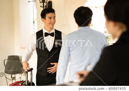 Men and women hotel staff Men and women hotel staff 60897435