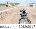 Surveyor equipment tacheometer or theodolite at road construction site. 60898017