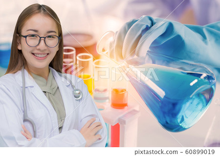 scientist with equipment and science experiments, laboratory glassware containing chemical liquid scientist with equipment and science experiments, laboratory glassware containing chemical liquid 60899019
