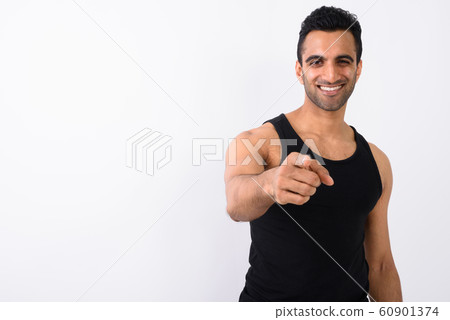 Young handsome Indian man against white background Young handsome Indian man against white background 60901374