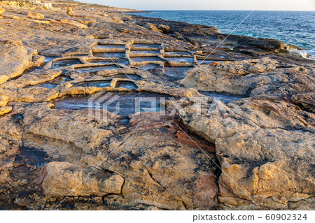 Salt evaporation ponds off the coast of Gozo 60902324