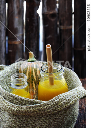 butternut squash milk bottle, yellow healthy, nutritious drink for breakfast  60902838