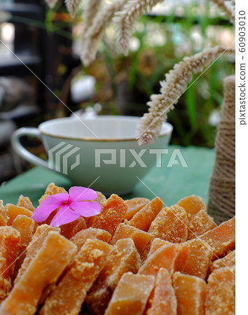 Vietnamese traditional food for Tet holiday, yellow sweet potato jam on green Vietnamese traditional food for Tet holiday, yellow sweet potato jam on green 60903010