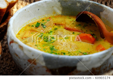Delicious yellow vegan curry dish bowl with bread for breakfast, homemade Vietnamese food Delicious yellow vegan curry dish bowl with bread for breakfast, homemade Vietnamese food 60903174