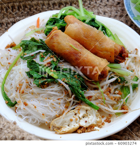 vietnamese vegetarian food for breakfast, rice noodle with fried spring roll, vegetables for vegan meal 60903274