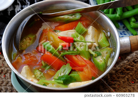 Vietnamese vegan soup in pot from vegetables are okra, tofu, tomato 60903278