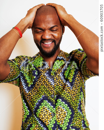 portrait of young handsome african man wearing bright green national costume smiling gesturing, entertainment stuff 60903705