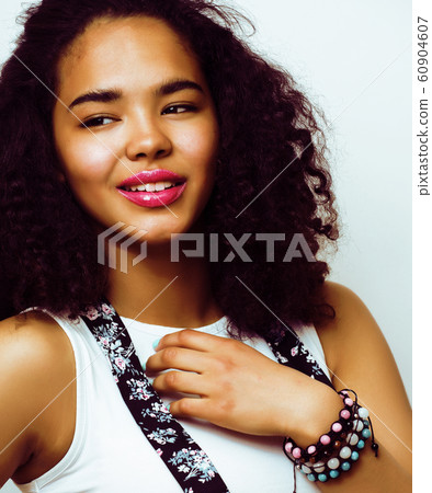 young pretty african american woman happy smiling posing against white background, lifestyle people concept 60904607