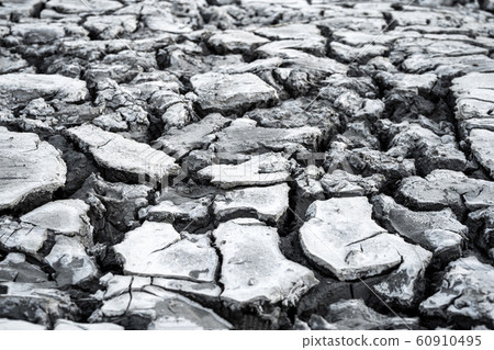 Arid land, lack of water will cause cracked soil, Arid land, lack of water will cause cracked soil, 60910495