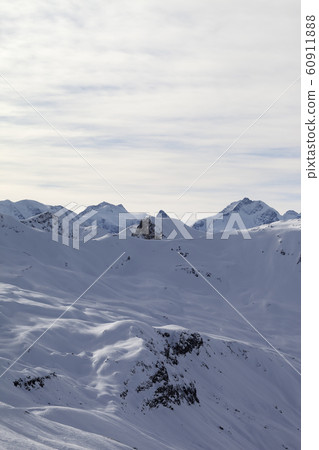 Snowy off-piste ski slope at high winter mountains 60911888