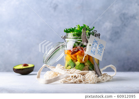 Homemade salad in glass jar with quinoa and vegetables with label lunch time no plastic and take Homemade salad in glass jar with quinoa and vegetables with label lunch time no plastic and take 60912095