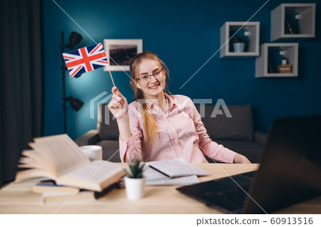 Cheerful Young Ginger Student Girl in Glasses 60913516