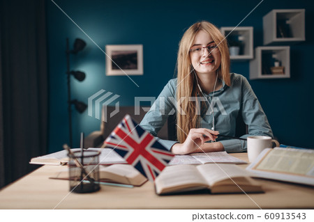 Young Enthusiastic Girl Studying English at Home Young Enthusiastic Girl Studying English at Home 60913543