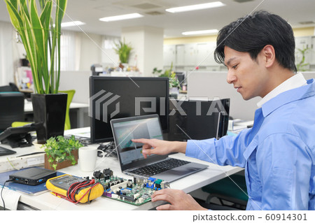 Engineer 1 designing while checking Engineer 1 designing while checking 60914301
