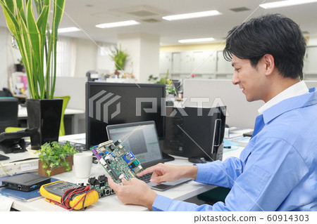 Engineer 1 designing with board 60914303