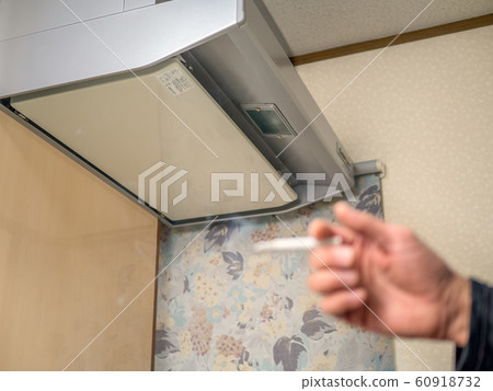 The only smoking area in the home, under the kitchen ventilation fan 60918732