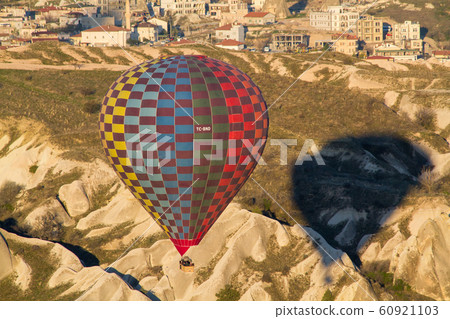 Hot air balloon flying over spectacular Cappadocia 60921103