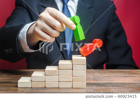 A businessman replaces an employee with a new one on career ladder. Head Offset. Business optimization. Fight corruption. System recovery. Strengthening change of power, capture control of business. 60923415