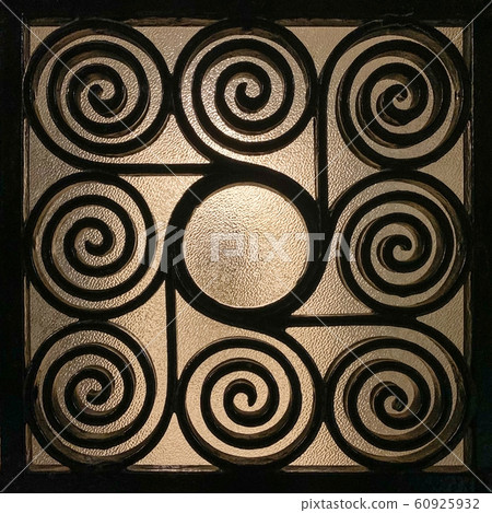 Wrought Greek iron grille made of spirals Wrought Greek iron grille made of spirals 60925932