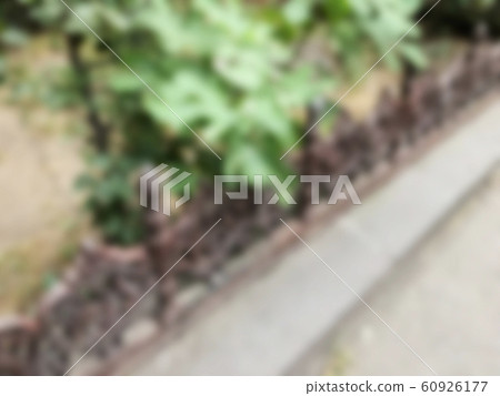 Blurred iron fence background. Soft focus Blurred iron fence background. Soft focus 60926177