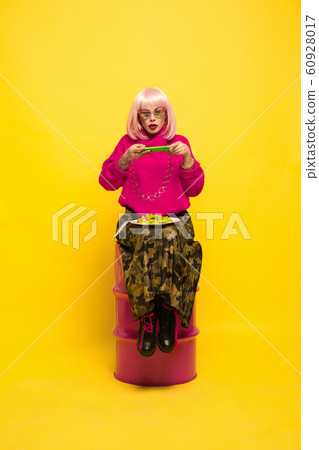 Caucasian woman's portrait isolated on yellow studio background, influencer be like 60928017