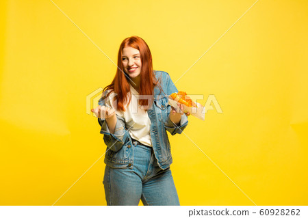 Caucasian woman's portrait isolated on yellow studio background, follower be like Caucasian woman's portrait isolated on yellow studio background, follower be like 60928262