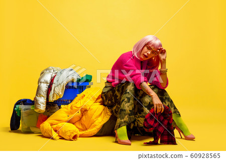 Caucasian woman's portrait isolated on yellow studio background, influencer be like 60928565