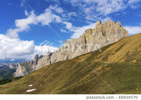 Peaks of Dolomites in the afternoon light. 60930570