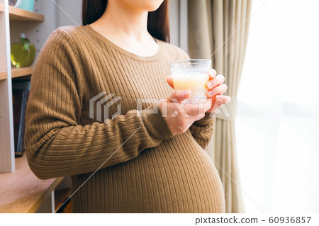 Pregnant woman drinking amazake rice koji drinking drip 60936857