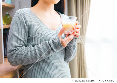 Woman drinking amazake rice koji drinking drip 60936859