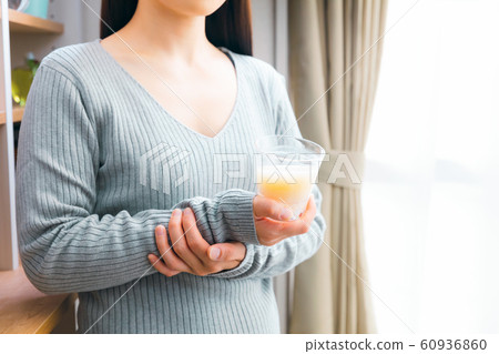 Woman drinking amazake rice koji drinking drip Woman drinking amazake rice koji drinking drip 60936860
