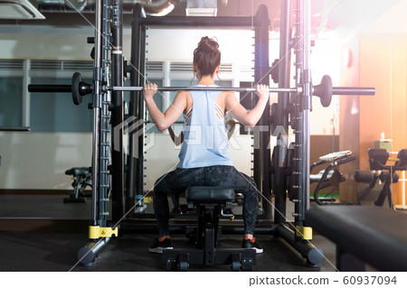 Young woman, muscle training, gym Young woman, muscle training, gym 60937094
