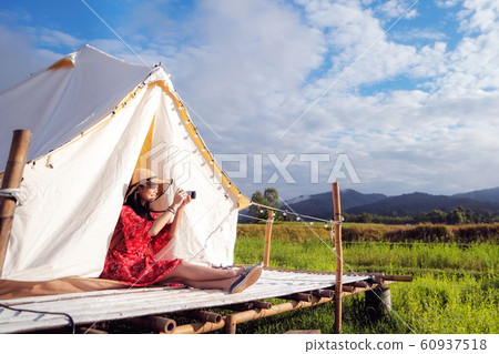 Asian girl take a photo by camera in Countryside Asian girl take a photo by camera in Countryside 60937518
