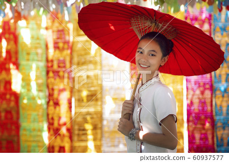 Asian girl in northern traditional costume and red Asian girl in northern traditional costume and red 60937577