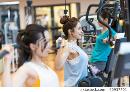 Young woman, trainer, gym 60937791