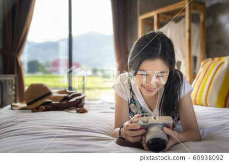 Thai girl relax in bed room with country Thai girl relax in bed room with country 60938092