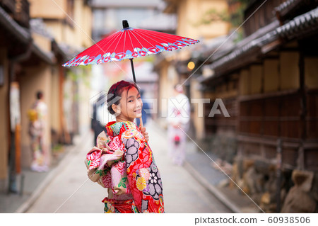 Japanese girl walk in kyoto old market Japanese girl walk in kyoto old market 60938506