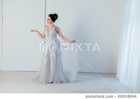 brunette woman in gray wedding gown white brunette woman in gray wedding gown white 60938604