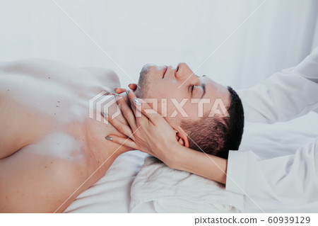 doctor cosmetologist doing facial massage men spa treatments doctor cosmetologist doing facial massage men spa treatments 60939129