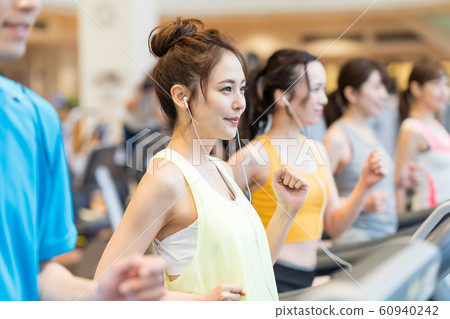 Young woman, gym, running machine 60940242