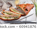 Salmon and broccoli pie on a rustic table 60941876