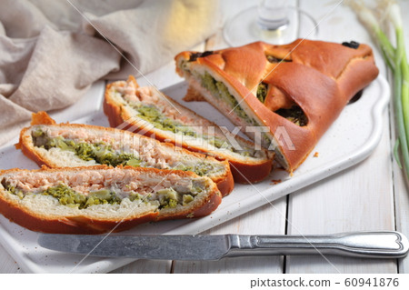 Salmon and broccoli pie on a rustic table Salmon and broccoli pie on a rustic table 60941876
