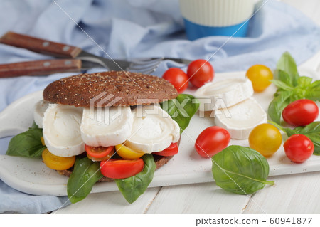 Sandwich with rye bread, goat cheese, tomatoes, Sandwich with rye bread, goat cheese, tomatoes, 60941877