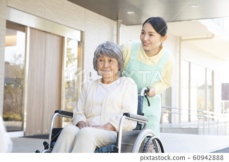 Female, Business, Caregiver, Helper, Elderly, Senior, Wheelchair, Walk Female, Business, Caregiver, Helper, Elderly, Senior, Wheelchair, Walk 60942888