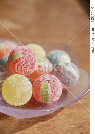 Colorful candy on a glass plate Colorful candy on a glass plate 60944142