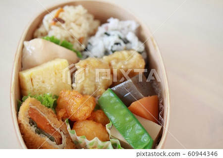 Two types of rice in a bento box Two types of rice in a bento box 60944346