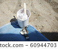 pack of ice cream with a stick and shells 60944703