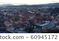 Evening aerial view of small medieval town in Europe with historic buildings, church and a castle, Slovenska Bistrica, Slovenia 60945172