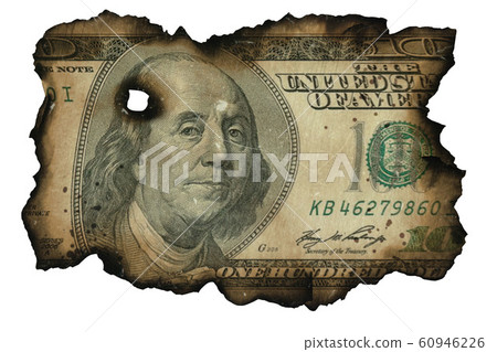 Burned fragment of US dollar banknote on white 60946226