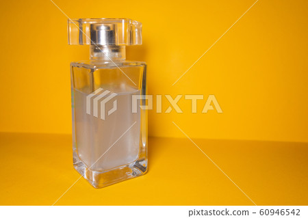 Transparent glass bottle with sky blue liquid on 60946542